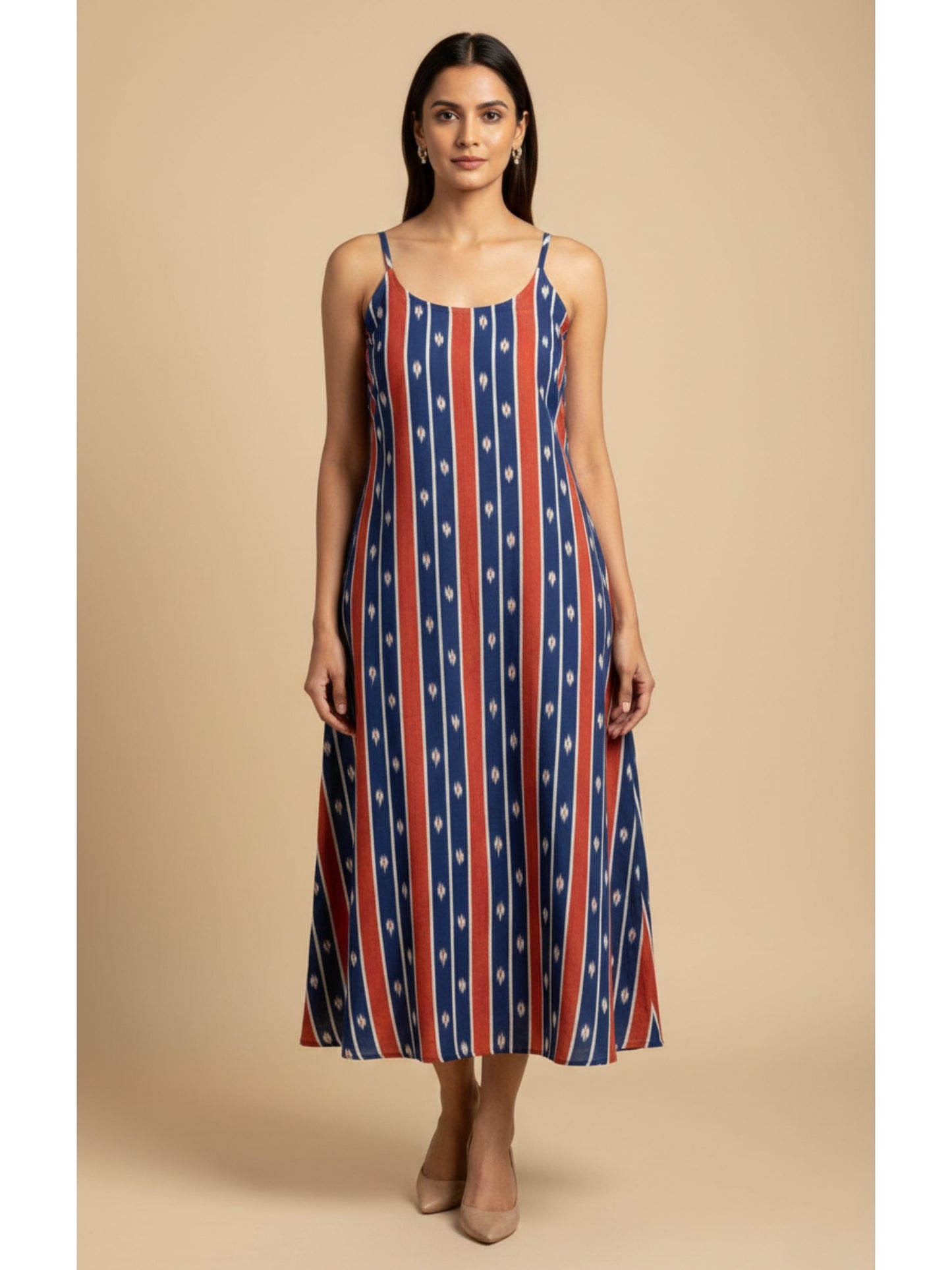 Front view of handmade blue and red striped ikat cotton noodle strap dress with pockets, 50-inch length, breathable summer wear.