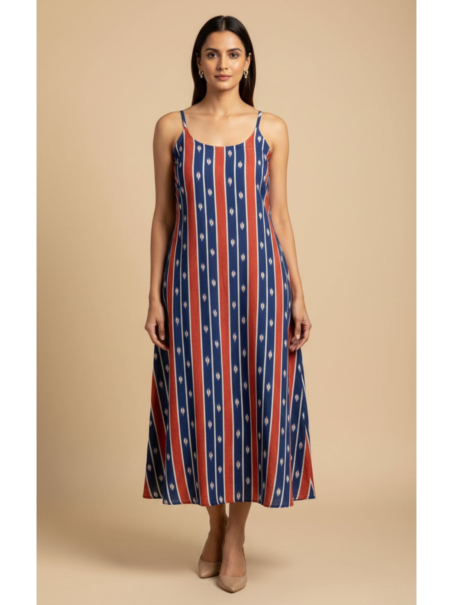 Front view of handmade blue and red striped ikat cotton noodle strap dress with pockets, 50-inch length, breathable summer wear.