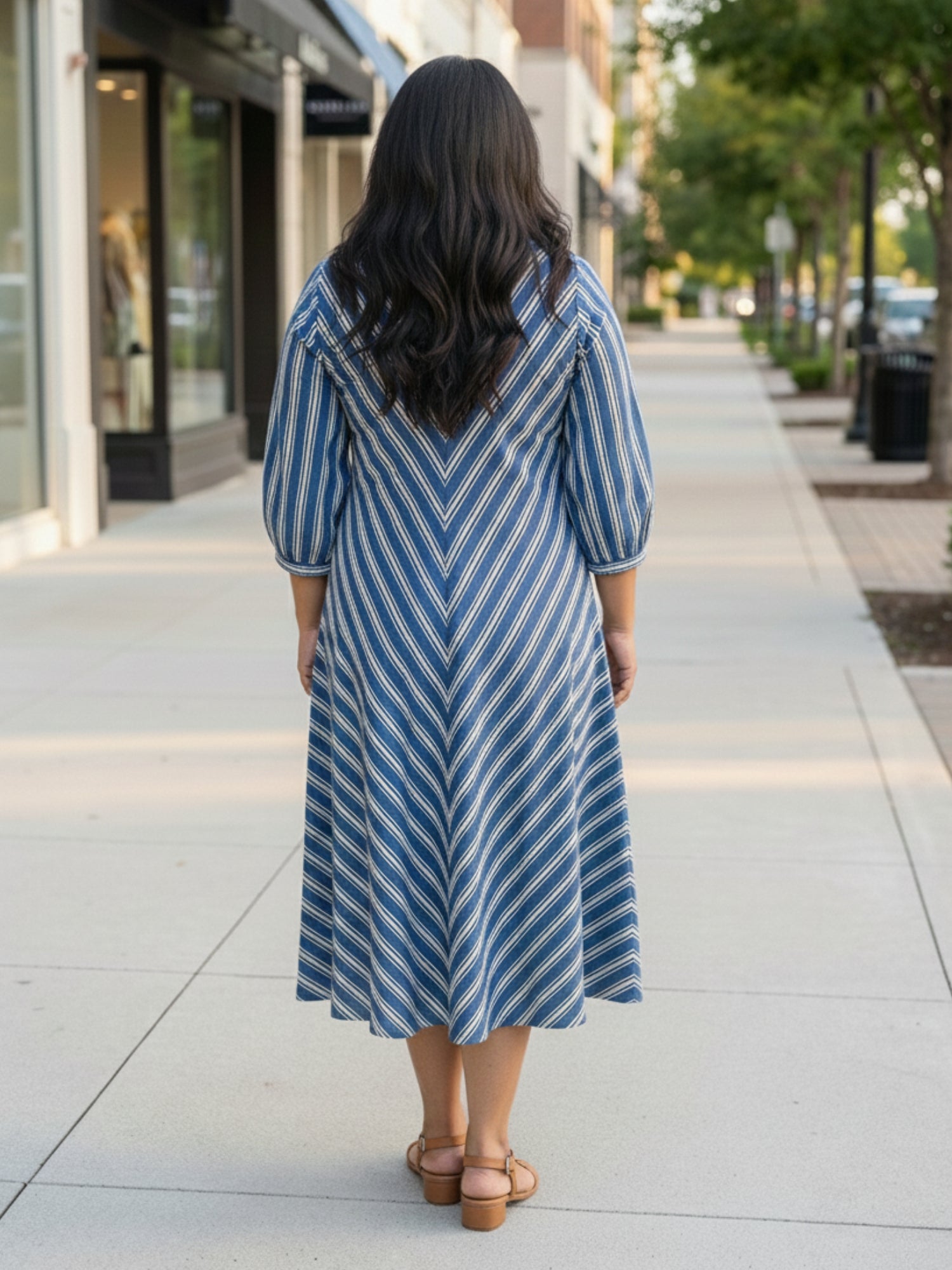 Blue striped dress for women, back view, clean silhouette with vertical stripes and comfortable fall