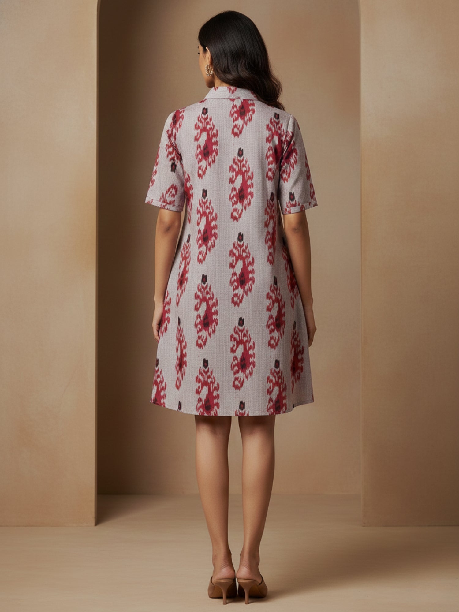 Back view of premium Ikat cotton short swing dress with smooth uninterrupted fall and above-knee length